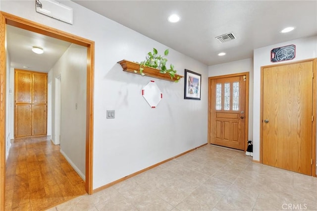 entrance foyer with baseboards, visible vents, and recessed lighting