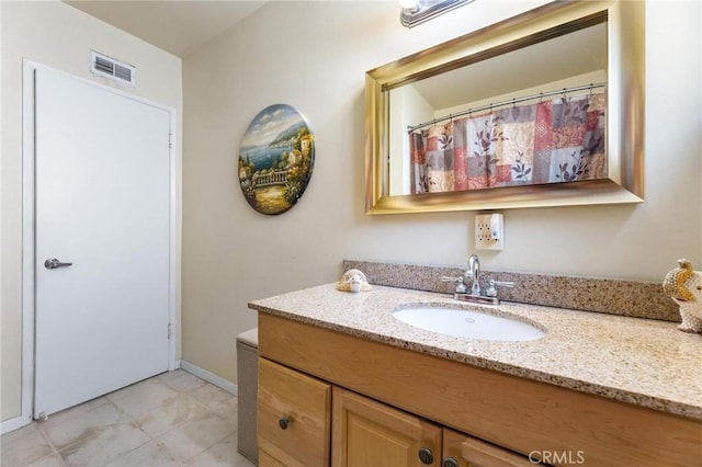 bathroom with visible vents and vanity