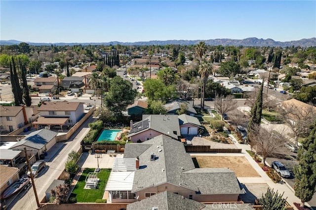 birds eye view of property with a residential view and a mountain view