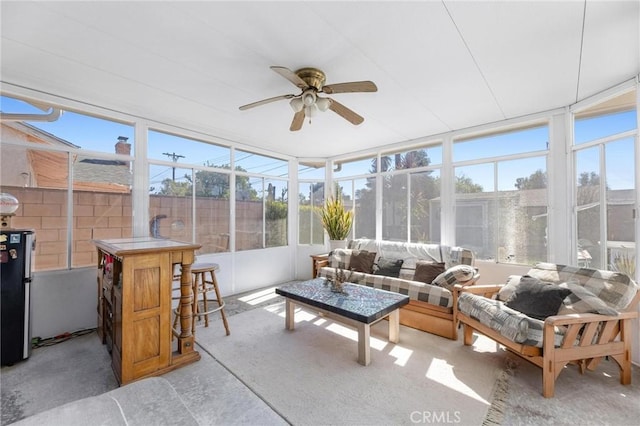 sunroom / solarium with a ceiling fan