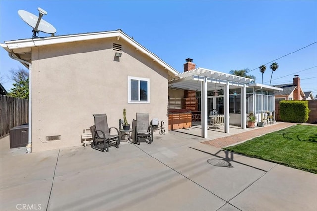 back of property featuring a patio area, fence, a pergola, and stucco siding