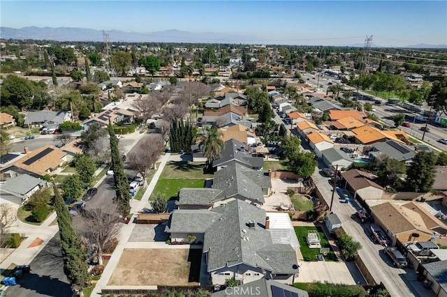 drone / aerial view with a residential view and a mountain view