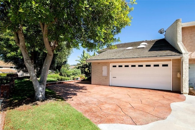 view of side of property with driveway