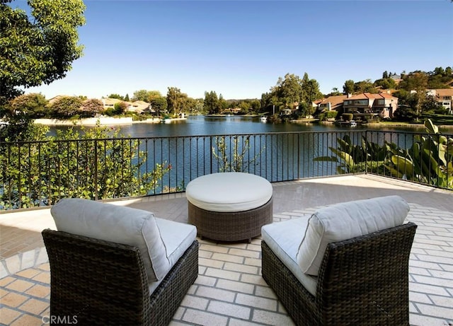 view of patio featuring a water view