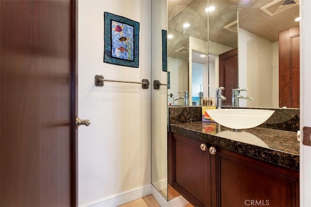 bathroom with visible vents and vanity