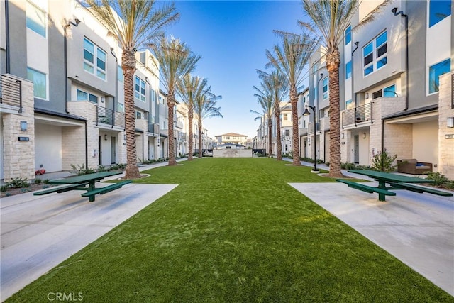 surrounding community featuring a residential view and a lawn