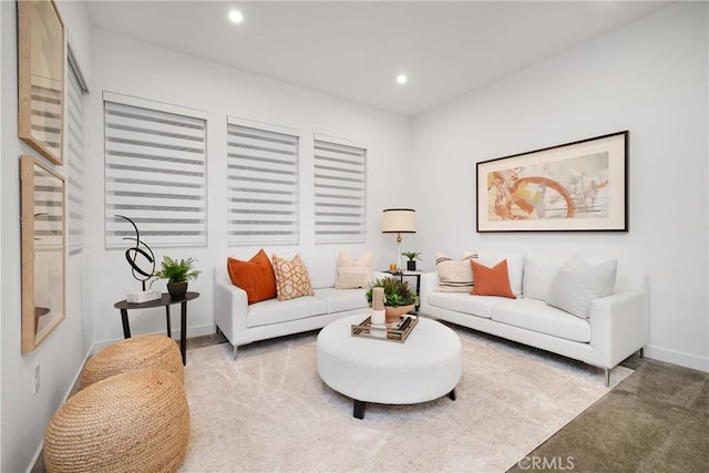 living area with baseboards, carpet flooring, and recessed lighting