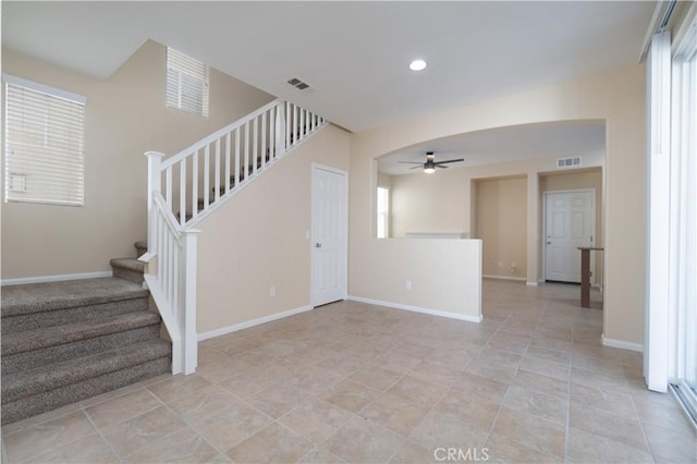 stairs featuring ceiling fan, visible vents, baseboards, and recessed lighting