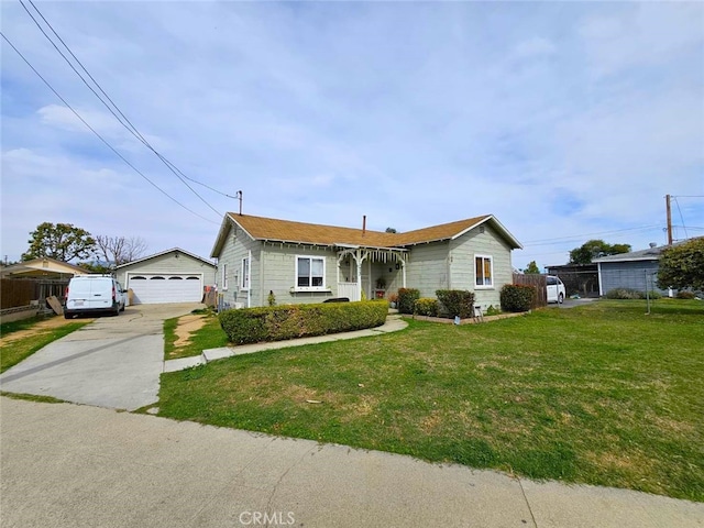 bungalow-style home with a garage, a front yard, fence, and an outdoor structure