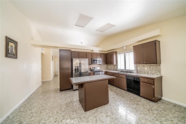 kitchen featuring stainless steel appliances, lofted ceiling, decorative backsplash, dark brown cabinetry, and a kitchen island