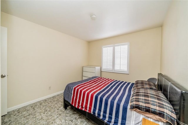 bedroom featuring baseboards