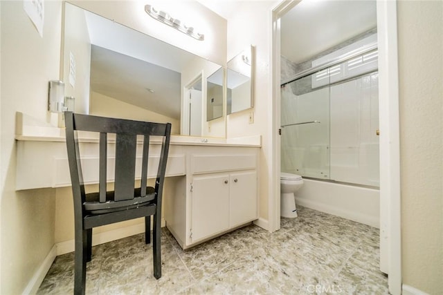 bathroom with toilet, enclosed tub / shower combo, baseboards, and vanity