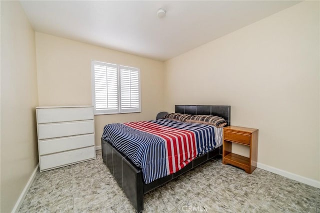 bedroom featuring baseboards