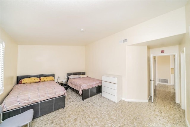 bedroom featuring visible vents and baseboards