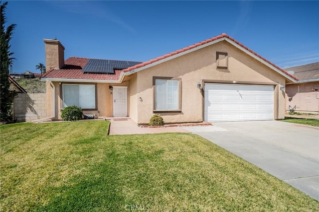 view of front facade featuring driveway, a garage, solar panels, a front lawn, and stucco siding