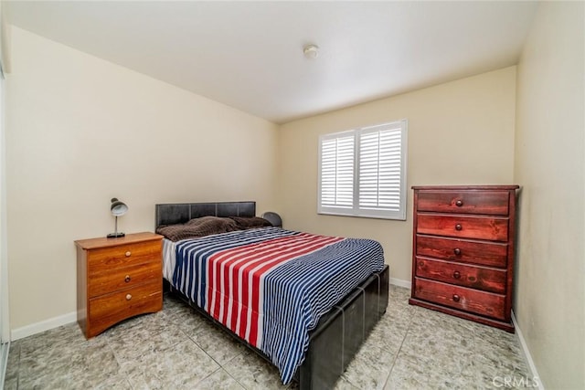 tiled bedroom with baseboards