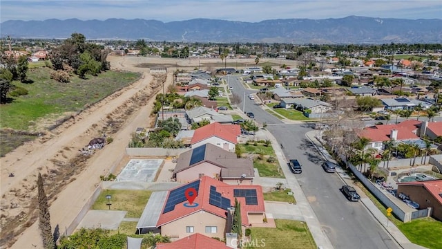 birds eye view of property with a residential view and a mountain view