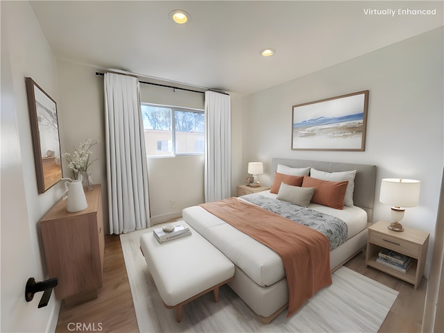 bedroom featuring light wood-type flooring and recessed lighting