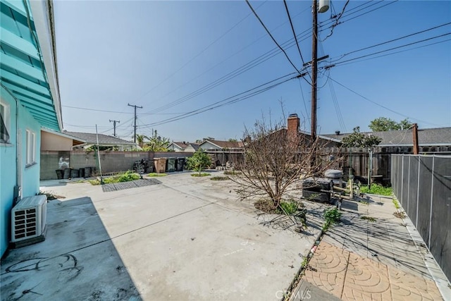 view of patio / terrace with ac unit and a fenced backyard