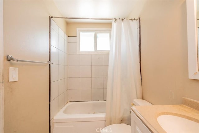 bathroom with shower / bath combination with curtain, vanity, and toilet