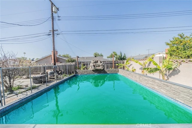 view of pool with a fenced in pool and a fenced backyard