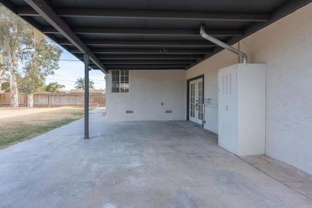 view of patio / terrace featuring french doors and fence