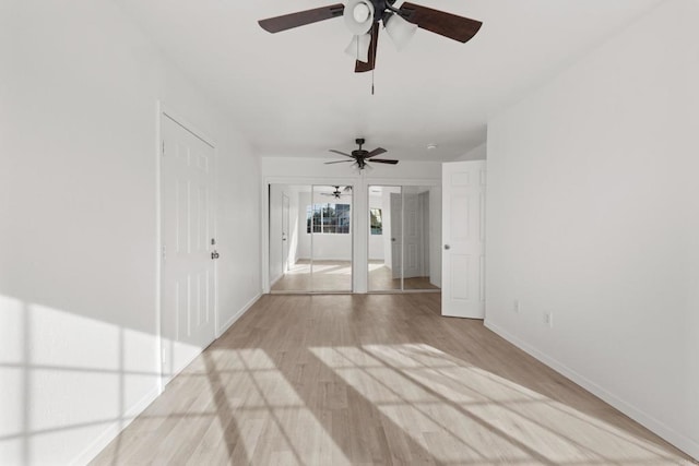 empty room featuring light wood finished floors and baseboards