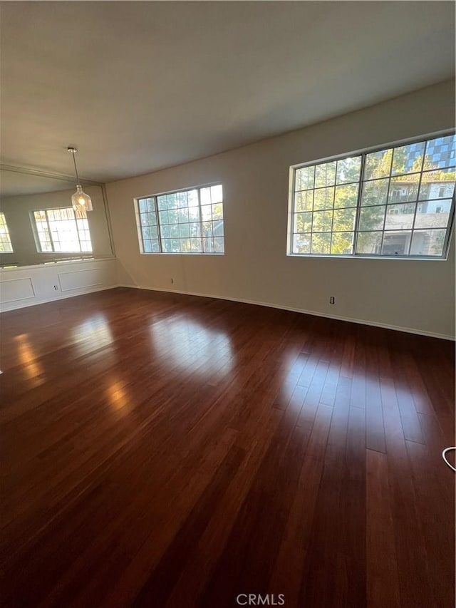 spare room with dark wood-type flooring