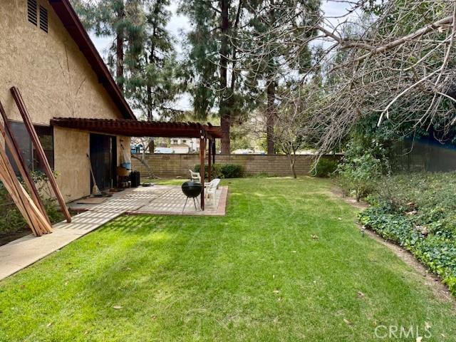 view of yard featuring a fenced backyard and a patio