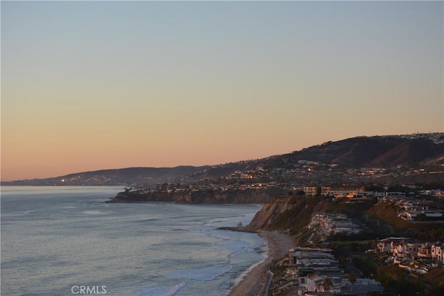 view of water feature featuring a mountain view and a beach view