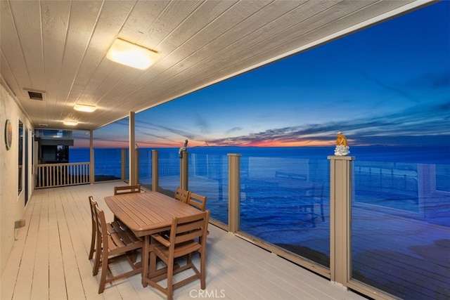 wooden deck with a water view