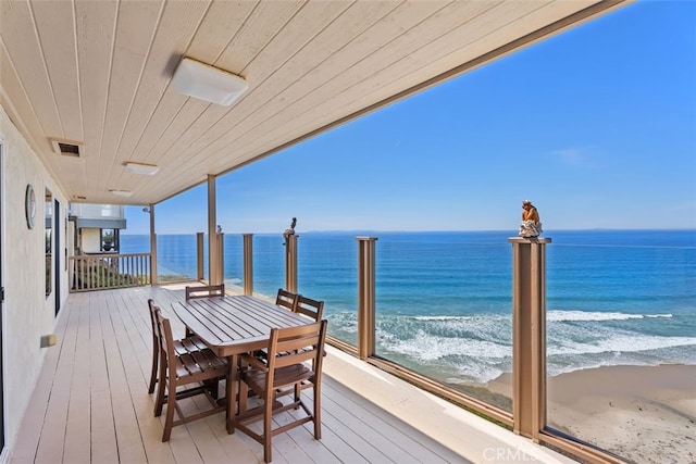 deck with visible vents and a water view