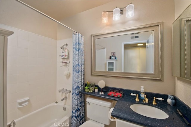 bathroom with visible vents, vanity, toilet, and shower / tub combo with curtain