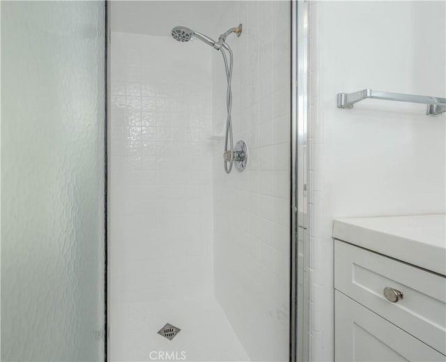 bathroom with a shower stall