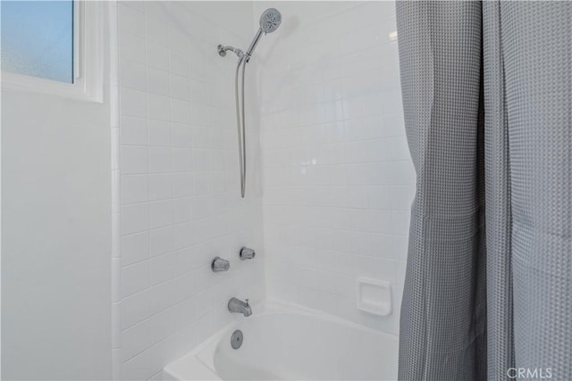 full bathroom featuring shower / bathtub combination with curtain