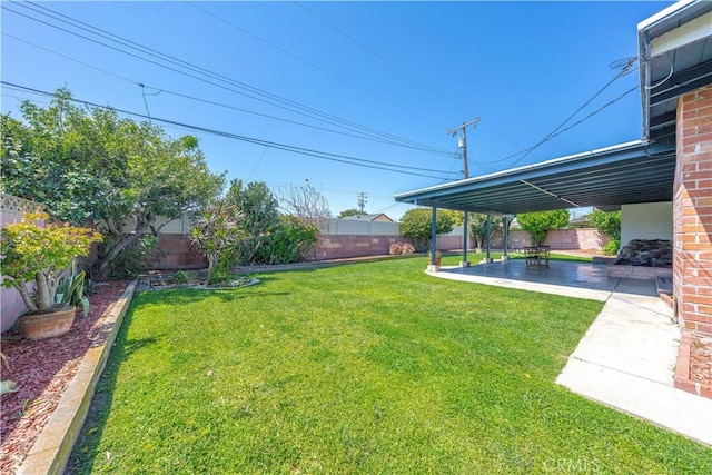 view of yard featuring a fenced backyard and a patio area