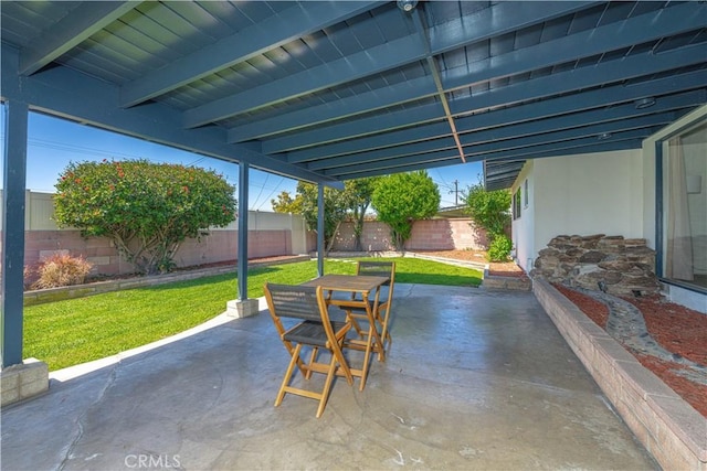 view of patio with outdoor dining space and a fenced backyard