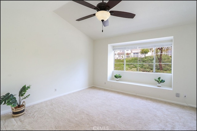 unfurnished room with carpet flooring, a ceiling fan, and baseboards