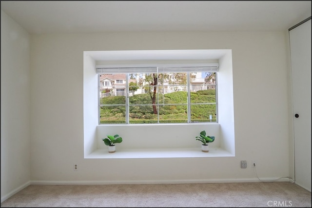 unfurnished room featuring carpet flooring