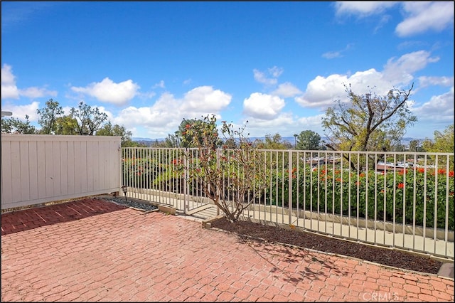 view of gate with fence