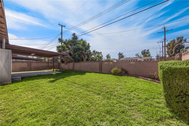 view of yard featuring a patio area and a fenced backyard