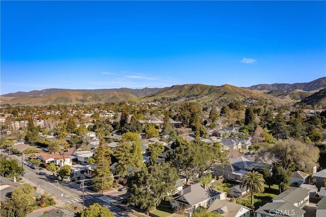 drone / aerial view featuring a residential view and a mountain view