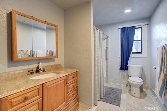 bathroom featuring visible vents, a shower with shower curtain, vanity, and toilet