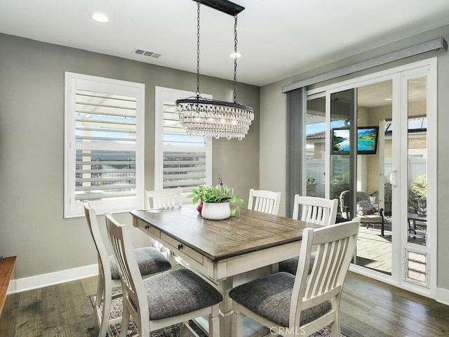 dining area featuring dark wood-type flooring, recessed lighting, visible vents, and baseboards