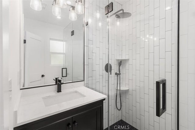 full bathroom with a stall shower and vanity