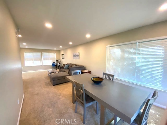 carpeted dining area featuring recessed lighting and baseboards