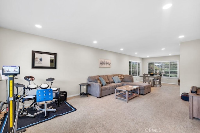 carpeted living room featuring recessed lighting and baseboards