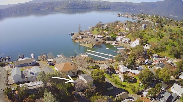 drone / aerial view with a residential view and a water view