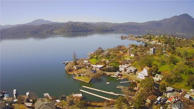 aerial view featuring a water and mountain view