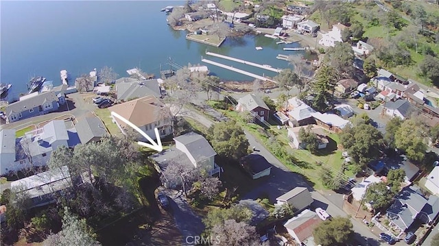 birds eye view of property featuring a residential view and a water view